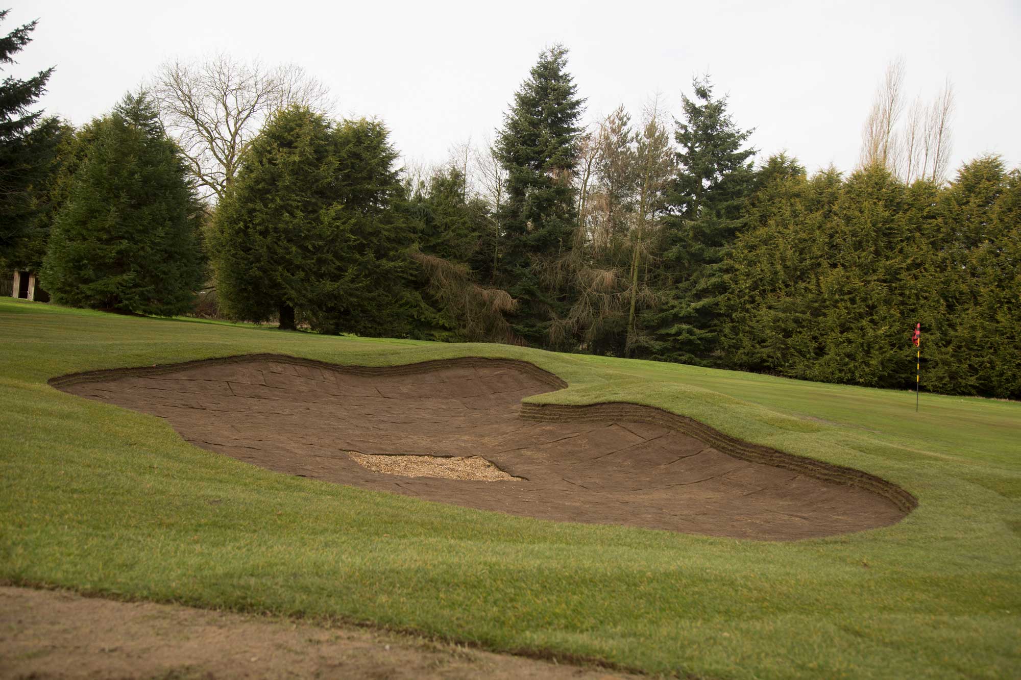 Bunker construction with revetting turf
